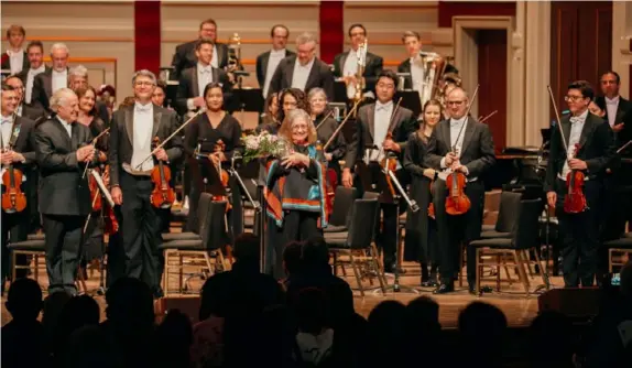  ?? Pittsburgh Symphony Orchestra ?? Composer Nancy Galbraith takes a bow with the Pittsburgh Symphony after the orchestra performed her “Storm of the South” in February.