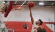  ?? NOELLE WITHERITE — FOR THE NEWS-HERALD ?? Mentor’s Jonah Waag eyes a layup Feb. 9against Euclid.