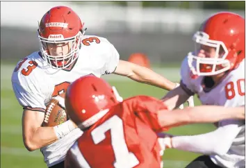  ?? Matthew Brown / Hearst Connecticu­t Media ?? New Canaan’s Chris Carratu (33) carries the ball during the 11th Annual Brian Wilderman Memorial Red and White game at Dunning Stadium in New Canaan on Friday.