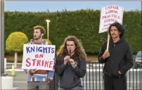  ?? ?? Knights Aaron Raff, left, and Graham Wojcik, center, and squire Jesus Lopez protest at Medieval Times in Buena Park.