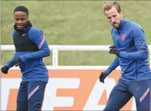  ?? (AFP) ?? England’s forward Harry Kane (R) and Raheem Sterling take part in England’s training session at St George’s Park in Burton-on-Trent, England, on Tuesday on the eve of their UEFA EURO 2020 semi-final match against Denmark.