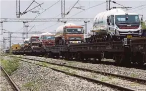  ??  ?? Oxygen tankers on a special train dubbed the ‘Oxygen Express’ arriving in Hyderabad yesterday.