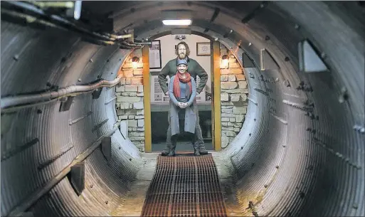  ?? [THAD ALLTON/THE TOPEKA CAPITAL-JOURNAL] ?? Mathew Fulkerson and wife Leigh Ann show off the Subterra Castle Airbnb location in a former undergroun­d missile silo near Eskridge, Kan.