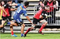  ??  ?? At the double: All Black No.8 Kieran Read runs in to score one of his two tries for the Crusaders