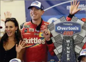  ?? NAM Y. HUH — THE ASSOCIATED PRESS ?? Kyle Busch, right, and his wife Samantha Busch celebrate with the trophy in Victory Lane after his win in a NASCAR Cup Series auto race at Chicagolan­d Speedway in Joliet, Ill., Sunday.