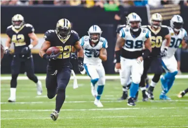  ?? Associated Press ?? New Orleans Saints running back Mark Ingram (22) carries on a 72-yard run in the first half of an NFL football game against the Carolina Panthers on Sunday in New Orleans.