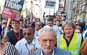  ??  ?? Sour: Jeremy Corbyn joins anti-Trump protests in London yesterday