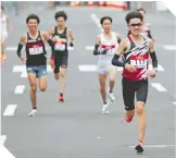  ?? / FOTO: AFP ?? El maratón de prueba en Japón fue visto por muy poca gente.