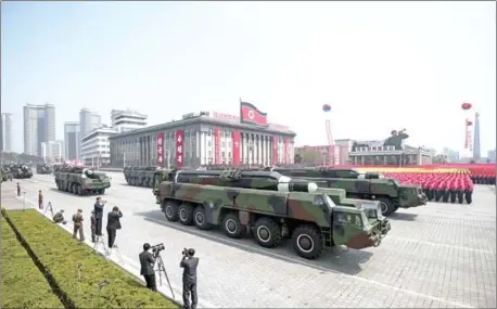  ?? ED JONES/AFP ?? A military parade marking the 105th anniversar­y of the birth of late North Korean leader and founder Kim Il-sung makes its way through Kim Il-sung Square in Pyongyang on April 15.