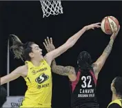 ?? BREANNA STEWART helan M. Ebenhack Associated Press ?? of Seattle defends Las Vegas’ Emma Cannon in Game 2 of the WNBA Finals.