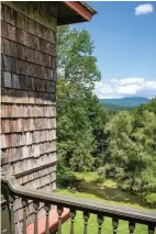  ??  ?? ABOVE Distant mountains are the view from a secondstor­ey balcony. When the Fleischman­ns arrived, the view would have been as wide as he horizon; trees have been encroachin­g for more than a century.