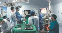  ?? PHOTOS PROVIDED TO CHINA DAILY ?? From top: Zhang Wei treats a Nepali patient at the B.P. Koirala Memorial Cancer Hospital in Nepal. Members of the 13th Chinese medical team conduct a minimally invasive surgery at the hospital in Nepal.