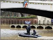  ??  ?? CCTV: Megan was last spotted by this bridge Search: Police boat on the Ouse yesterday