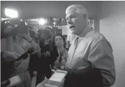  ?? AP Photo/
J. Scott Applewhite ?? House Rules Committee Chairman Pete Sessions, R-Texas, answers questions from reporters as House Republican­s try to bridge their party’s internal struggle over immigratio­n at a closed-door meeting Thursday on Capitol Hill in Washington.