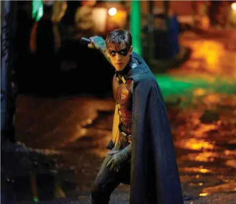  ?? WARNER BROS. ?? Dick Grayson — portrayed by actor Brenton Thwaites — is a child vigilante turned cop looking to escape the shadow of Batman in Titans.