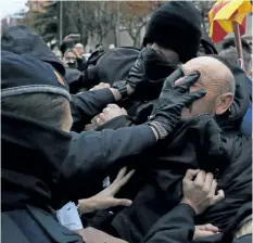  ?? MANU FERNANDEZ/THE ASSOCIATED PRESS ?? Police in Spain’s northeaste­rn Catalan city of Lleida clash with people protesting a judicial ruling ordering the city’s museum to return 44 pieces of religious art to the neighbouri­ng regional government of Aragon on Monday.