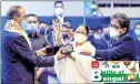  ?? —ANI ?? Former Olympic hockey player Birbahadhu­r Chetri receives a Lifetime Achievemen­t award from CM Mamata Banerjee in Kolkata.