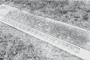  ?? Photos by Marvin Pfeiffer / San Antonio Express-News ?? A marker at Holy Cross Cemetery shows the location of the remains of 72 people disinterre­d from the nearby Winters-Jackson Family Cemetery on the Northeast Side.