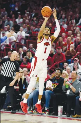  ?? Associated Press ?? Taking aim: Arkansas guard Isaiah Joe takes a shot during the Razorbacks' SEC clash against Kentucky Saturday in Fayettevil­le.