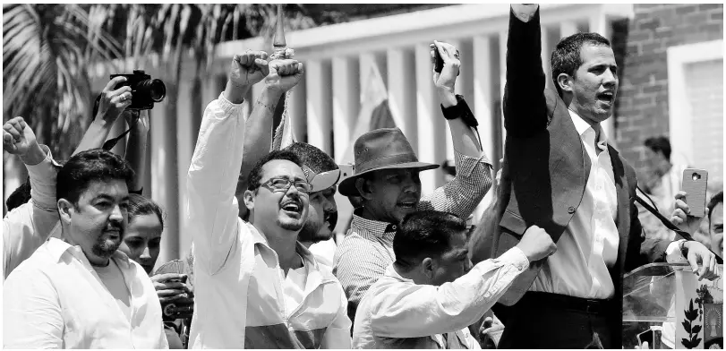  ?? AP ?? Venezuelan opposition leader Juan Guaidó (right) has declared himself interim president of Venezuela.