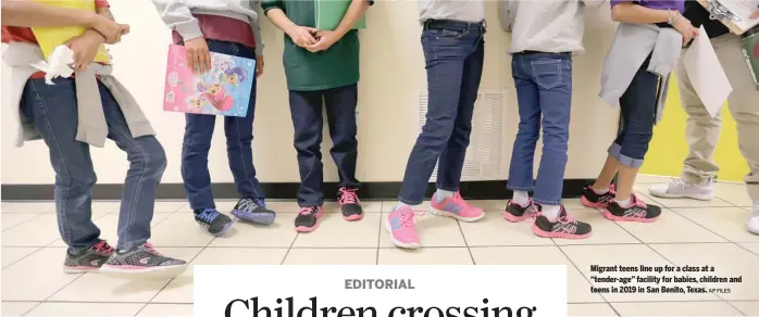  ?? AP FILES ?? Migrant teens line up for a class at a “tender-age” facility for babies, children and teens in 2019 in San Benito, Texas.