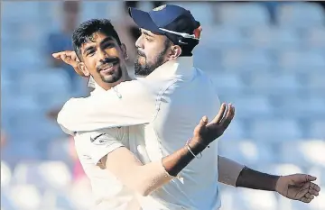  ?? AFP ?? Jasprit Bumrah (left) celebrates with KL Rahul after dismissing Jos Buttler for 106 on the fourth day of the third Test against England in Nottingham on Tuesday. Bumrah claimed five wickets to leave India a wicket away from victory.