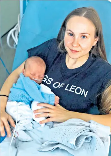  ?? ?? Robyn Davis with her son Orlando, who died two weeks after being born by emergency Caesarean section