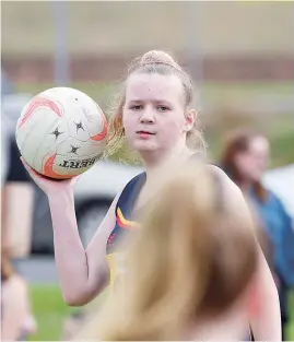  ??  ?? Longwarry’s Livia Pask looks down the court for a teammate on Monday night when twilight netball made its return.