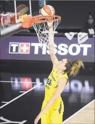  ?? Phelan M. Ebenhack / Associated Press ?? Seattle Storm forward Breanna Stewart scores a basket on a breakaway play during the first half of a WNBA game against the New York Liberty on Saturday.