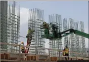  ?? ASSOCIATED PRESS FILE PHOTO ?? Work continues on a bridge on the Interstate Highway 75 project in Troy, Mich.