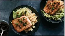  ??  ?? Roasted Salmon With Miso Rice and Ginger-Scallion Vinaigrett­e. There is a nice array of flavors and textures in this meal from Kay Chun. (The New York Times/David Malosh)