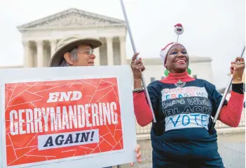  ?? ANDREW HARNIK/AP ?? Activists demonstrat­e Wednesday during a case concerning North Carolina Republican­s’ efforts to draw congressio­nal districts heavily in their favor that were blocked by a Democratic majority on the state Supreme Court.