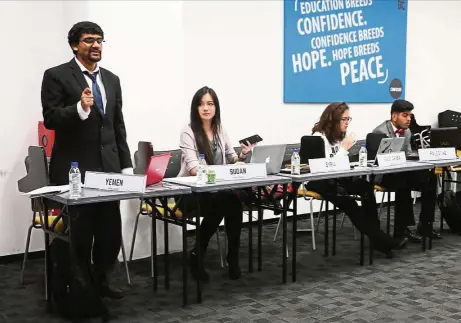  ??  ?? A participan­t making a point at the BAC Model United Nations Conference 2016.