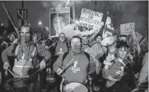  ?? Amir Levy/getty Images ?? Protesters march against a plan to overhaul the Israeli legal system by Prime Minister Benjamin Netanyahu and his allies.