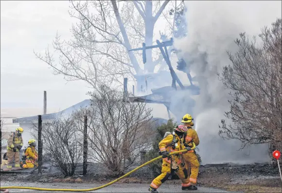  ?? ASHLEY THOMPSON ?? Firefighte­rs from multiple department­s teamed up to battle a blaze that broke out in a Hortonvill­e home the morning of March 6. For more details, turn to page A2.