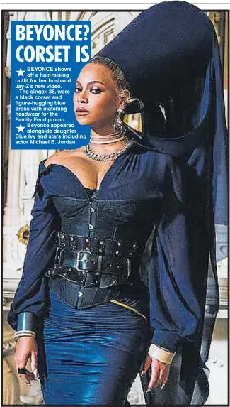  ??  ?? BEYONCE shows off a hair-raising outfit for her husband Jay-Z’s new video.
The singer, 36, wore a black corset and figure-hugging blue dress with matching headwear for the Family Feud promo. Beyonce appeared alongside daughter Blue Ivy and stars...