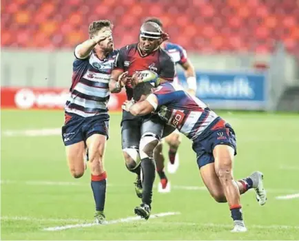  ?? Picture: SUPPLIED ?? HANG IN THERE: Andisa Ntsila holds on to the ball under pressure in a game during his time with the Southern Kings