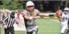  ?? Pete Paguaga / Hearst Connecticu­t Media ?? St. Joseph quarterbac­k Matt Morrissey stretches out for the end zone against Danbury on Saturday in Trumbull.