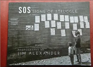  ??  ?? Award-winning Atlanta photograph­er and activist Jim Alexander’s new book is “SOS: Signs of Struggle: Photograph­s by Jim Alexander.” His work can be seen in an exhibit at the Roswell Cultural Arts Center this month.