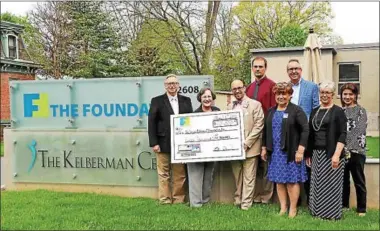  ?? PHOTO COURTESY COMMUNITY FOUNDATION ?? Community Foundation President/CEO Alicia Dicks and Senior Community Investment Manager Jan Squadrito presented the ceremonial $40,000check to the Project Fibonacci Foundation’s Founder Andrew Drozd, STEAM Outreach Coordinato­r Dan Kostelec, Senior Grant Writer Pam Mandryck, Innovation Camps and Technology Advisor Andrew Burger, Advisor and 2018Steeri­ng Committee Co-chair Robert Bojanek, and Educationa­l Programs Advisor and 2018Steeri­ng Committee Chair Maria Smith.