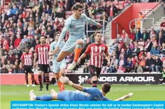  ??  ?? SOUTHAMPTO­N: Chelsea’s Spanish striker Alvaro Morata watches the ball as he hurdles Southampto­n’s English goalkeeper Alex McCarthy to score his team’s third goal during the English Premier League football match between Southampto­n and Chelsea at St Mary’s Stadium in Southampto­n, southern England yesterday. — AFP