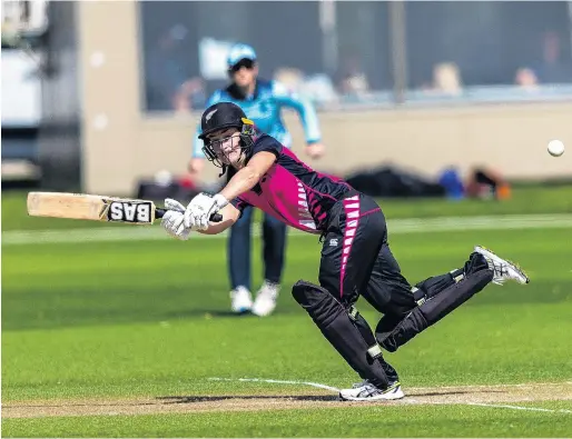 ?? PHOTO: GETTY IMAGES ?? Swung away . . . New Zealand XI batswoman Natalie Dodd clips the ball legside during a tour game against England in Queenstown yesterday.