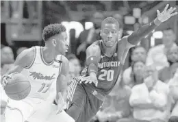  ?? WILFREDO LEE/AP ?? Heat forward Rodney McGruder tries to get by Pistons guard Dwight Buycks during the first half of Saturday’s game.