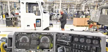  ?? RICK KINTZEL/THE MORNING CALL FILE PHOTO ?? Mack Trucks is among the heavy-duty truck manufactur­ers grappling with a semiconduc­tor shortage that is straining production. In this September 2020 photo, a dashboard is ready to be installed at one of Mack’s assembly lines in Lower Macungie Township.