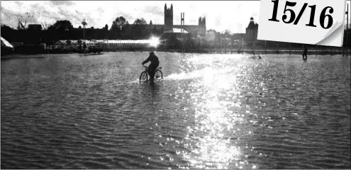  ??  ?? Thirty years ago… Paul Amos’s photo of the ferry Hengist beached after the 1987 storm; Canterbury Cathedral provides the backdrop as a cyclist rides in flood water at Sainsbury’s car park