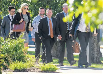  ?? KYLE TELECHAN/POST-TRIBUNE ?? Portage Mayor James Snyder arrives at the federal courthouse in Hammond with his attorneys for a pretrial hearing in September.