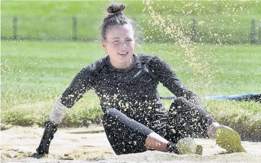  ?? PHOTO: PETER MCINTOSH ?? Making gains . . . Paralympic long jumper Anna Grimaldi trains at the Caledonian Ground in Dunedin yesterday.