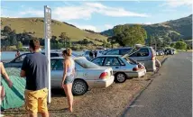  ??  ?? Freedom campers at French Farm on Banks Peninsula pack into a section of foreshore beside a 70kmh road. Campers are supposed to park two metres from the road.