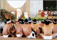  ?? ALESSANDRA TARANTINO ?? Flanked by Bishop David Martinez and Father Bruco Cadore, Pope Francis speaks to indigenous groups in Puerto Maldonado, Peru, Friday.