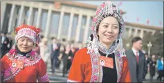  ??  ?? Delegates wearing ethnic minority outfits leave a session of the Chinese People’s Political Consultati­ve Conference in Beijing. — AFP photo